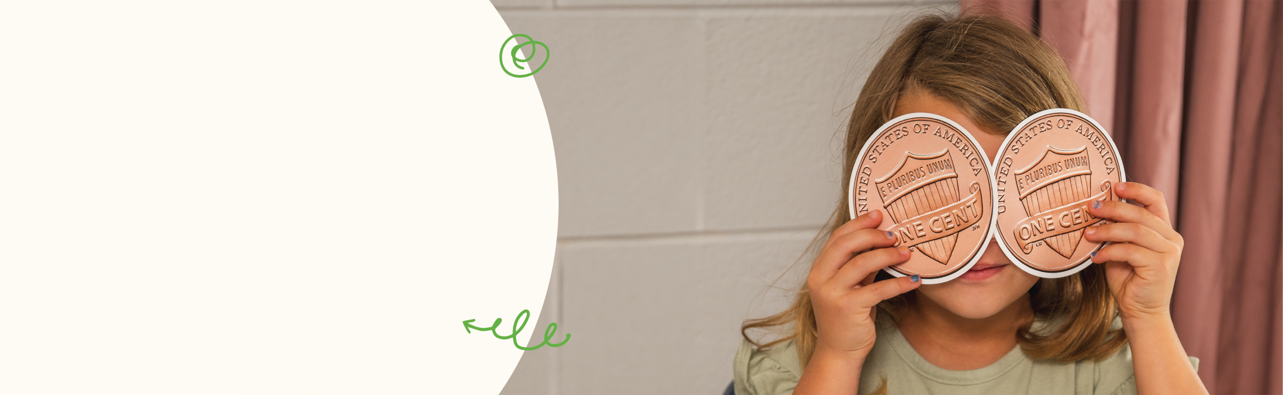 Girl holding paper penny coins over her eyes